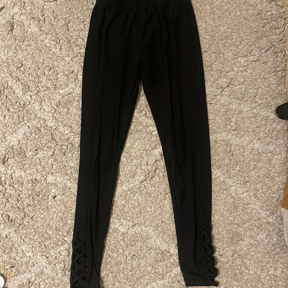 Black leggings with cross holes at bottom